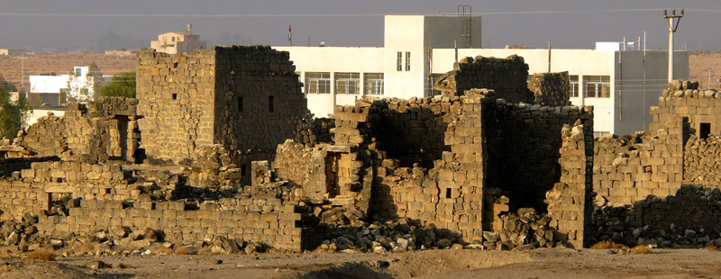 Main image: Ruins along the western edge of the ancient Byzantine and early Islamic town are located adjacent to the local boys' school, part of a modern community of several thousand surrounding the historical site.